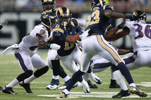 Rams WR Tavon Austin runs through the Baltimore Ravens defense in a preseason matchup.