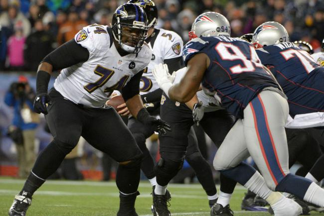 Ravens OT Michael Oher takes a step to his right moving back in pass protection while facing the Patriots in New England.