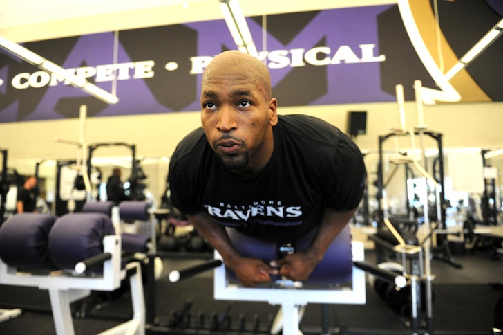 Ravens OT Eugene Monroe works out in the weight room.