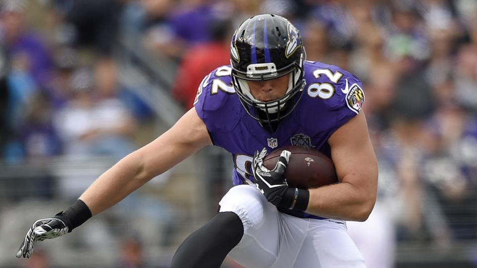 Baltimore Ravens tight end Nick Boyle (82) leaps over Cincinnati Bengals cornerback Dre Kirkpatrick (27) during the first half of an NFL football game in Baltimore.