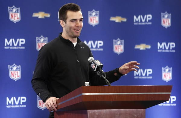 Baltimore Ravens quarterback Joe Flacco poses for a photo with the game MVP trophy at a press conference at the New Orleans Convention Center the day after defeating the San Francisco 49ers in Super Bowl XLVII at the Mercedes-Benz Superdome.