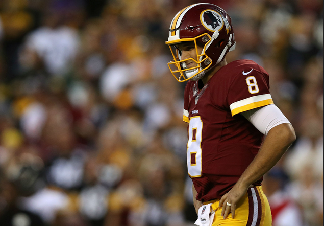 Redskins QB Kirk Cousins stands with hands on hips.