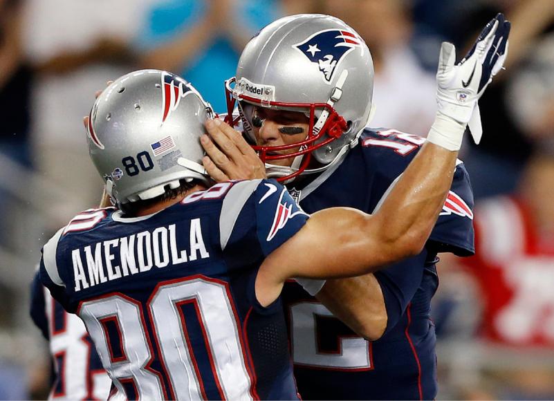 Tom Brady grabs Danny Amendola by the helmet.