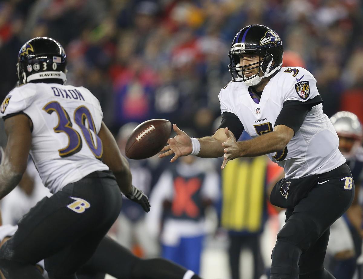 Joe Flacco pitches it forward to running back Kenneth Dixon