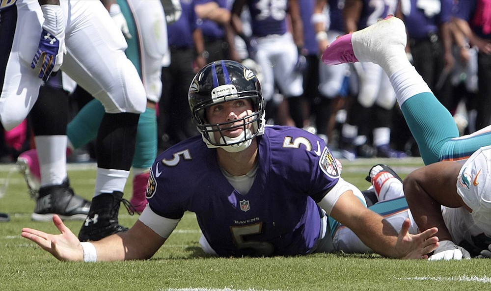 Ravens QB Joe Flacco on the ground after being sacked.