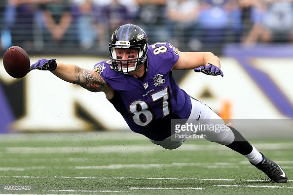 Ravens TE Maxx Williams reaches out to try to make a catch in Baltimore.