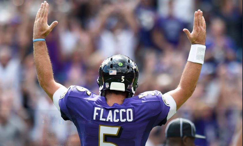 Joe Flacco signals for a TD vs. the Browns.