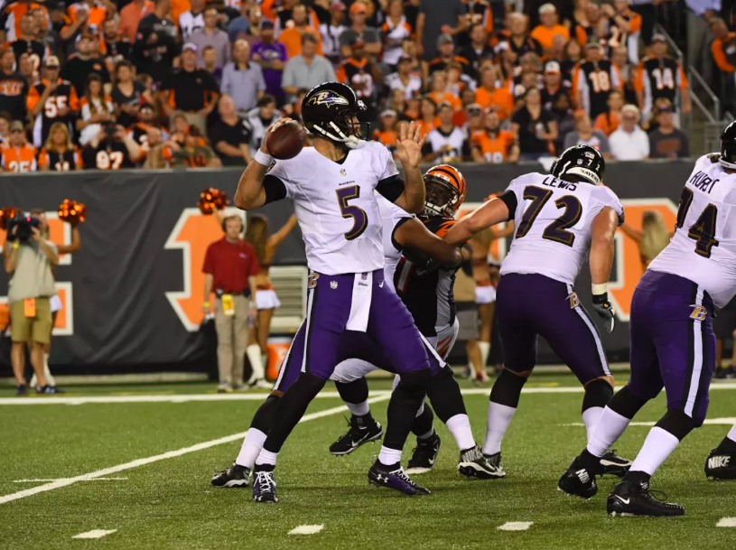 Joe Flacco throws against the Bengals.