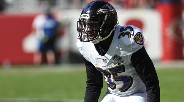 Ravens CB Shareece Wright lines up on defense wearing his white 20th season jersey.