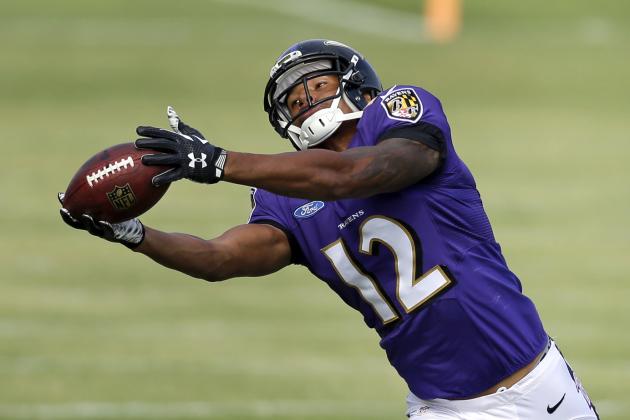 Darren Waller reaches out for a pass and catches it at Ravens training camp