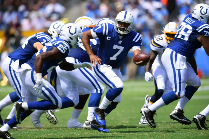 Colts uniforms handing off