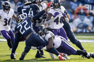 Pernell McPhee tackles Derrick Henry of the Tennessee Titans