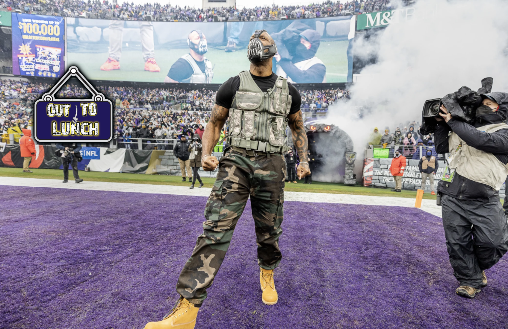 Terrell Suggs comes out in his bane mask and costume