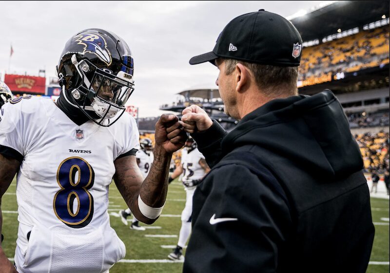 John Harbaugh and Lamar Jackson fist bump at Heinz Field pre-game